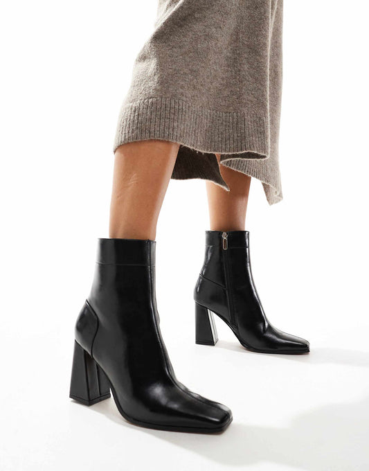 ASOS DESIGN Everest flared heel boots in black