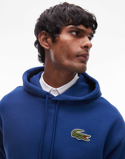 هودي بشعار Lacoste المميز باللون الأزرق