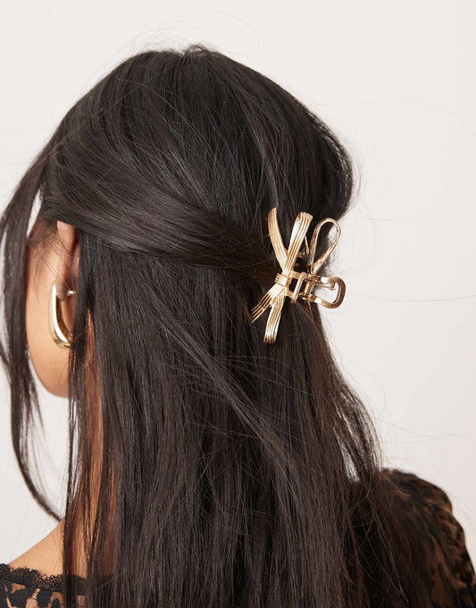 ASOS DESIGN hair claw with bow detail in gold tone