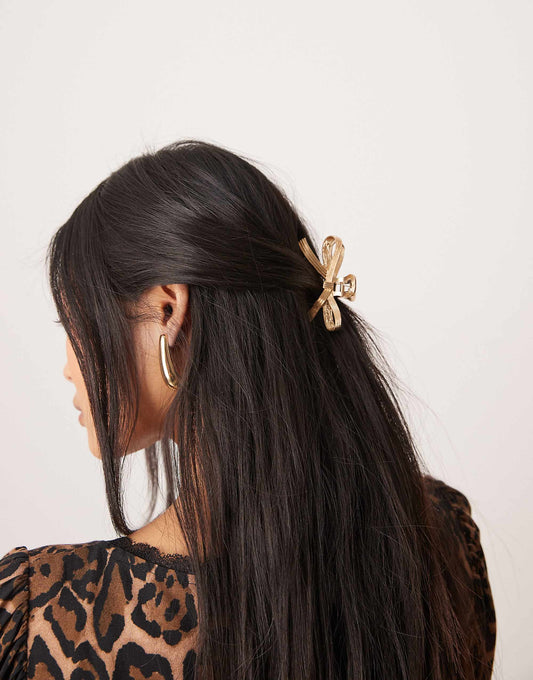 ASOS DESIGN hair claw with bow detail in gold tone