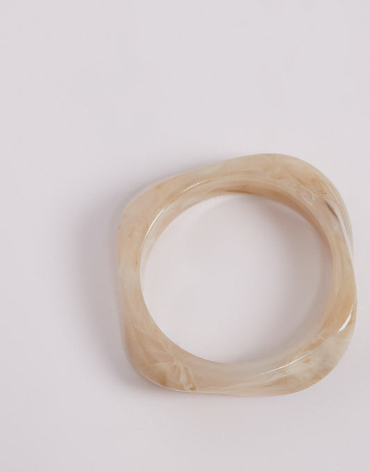 Kaiia chunky asymmetric resin bangle in champagne pearl
