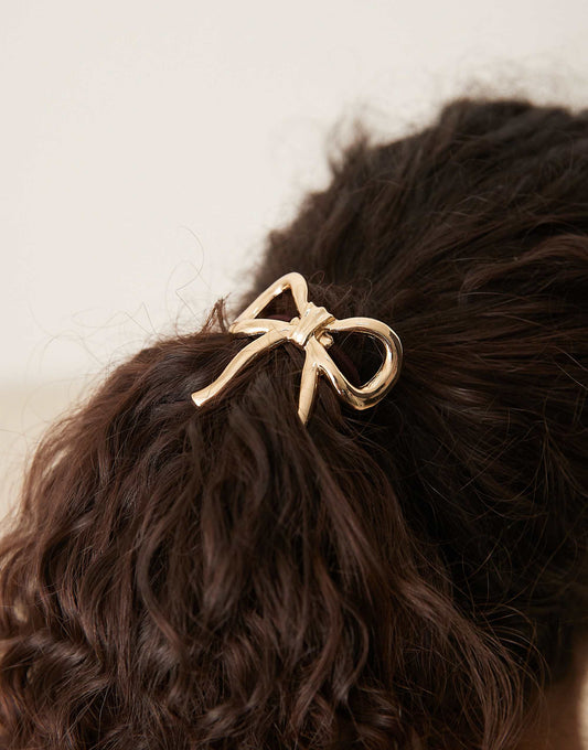 ASOS DESIGN hairband with metal bow detail in gold
