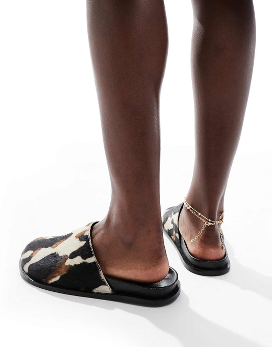 schuh Teale clog mules in cow print pony hair
