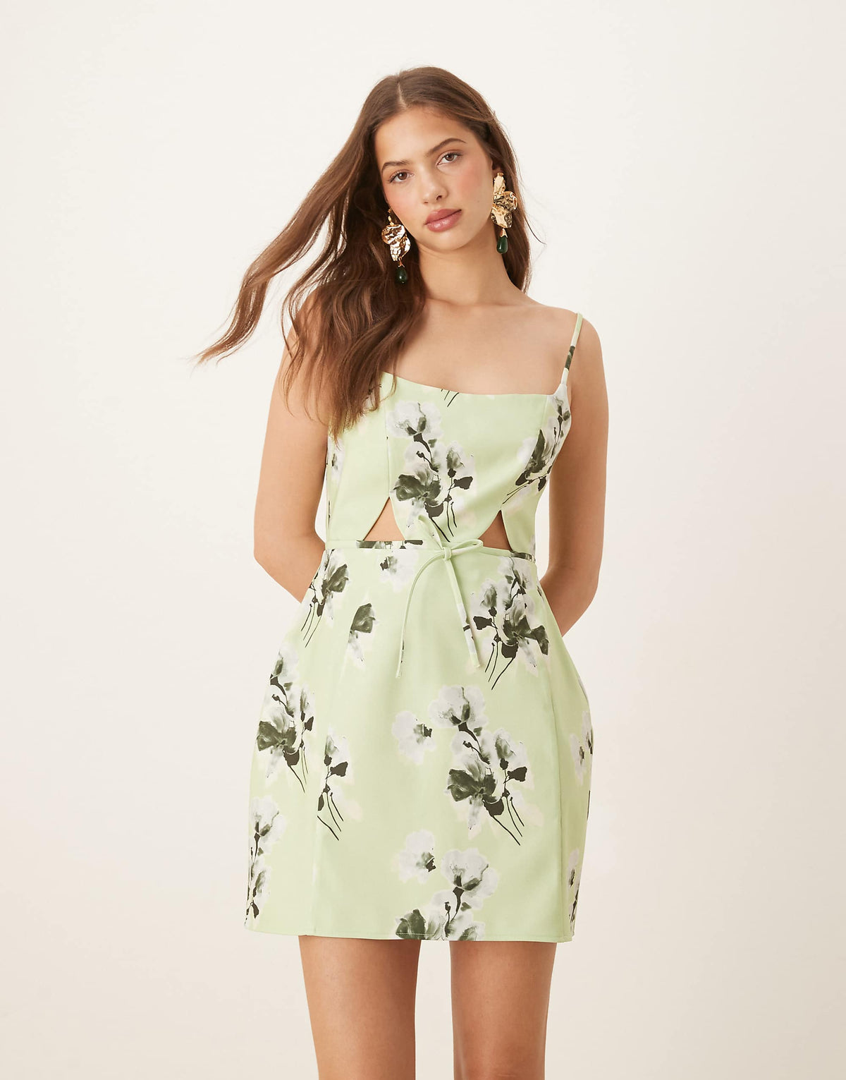 ASOS DESIGN structured cutout mini dress with bow in sage floral print