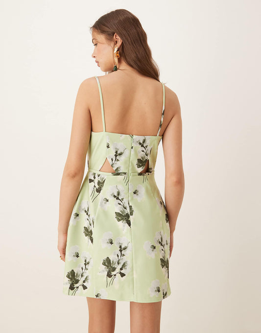 ASOS DESIGN structured cutout mini dress with bow in sage floral print