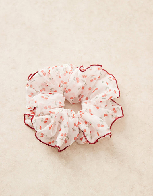 ASOS DESIGN oversized scrunchie with cherry print and contrast binding in red