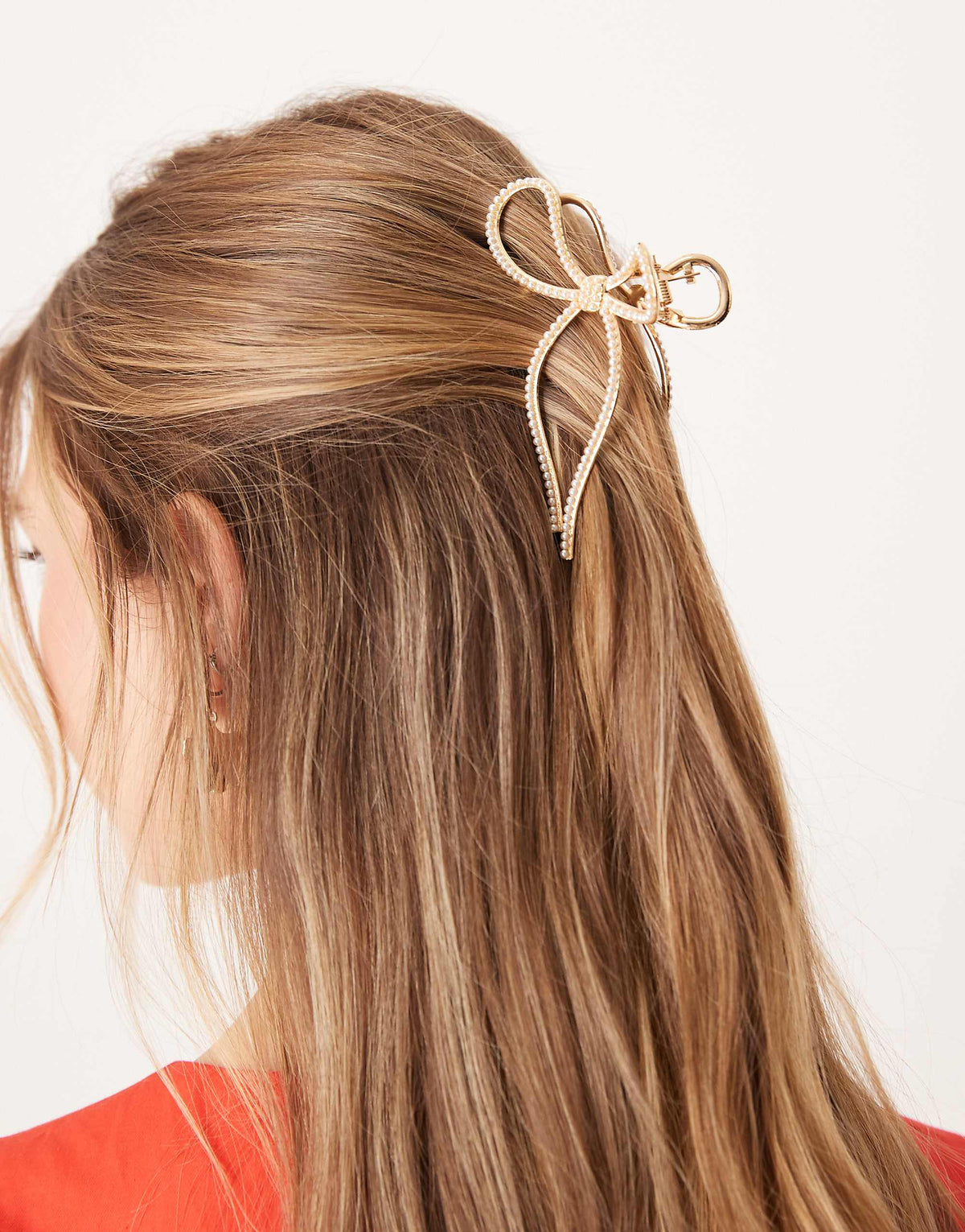 ASOS DESIGN metal hair claw in bow design with pearl detail