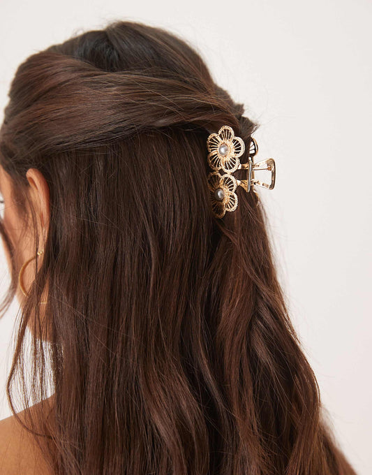 ASOS DESIGN hair claw with flower design and pearl detail in gold